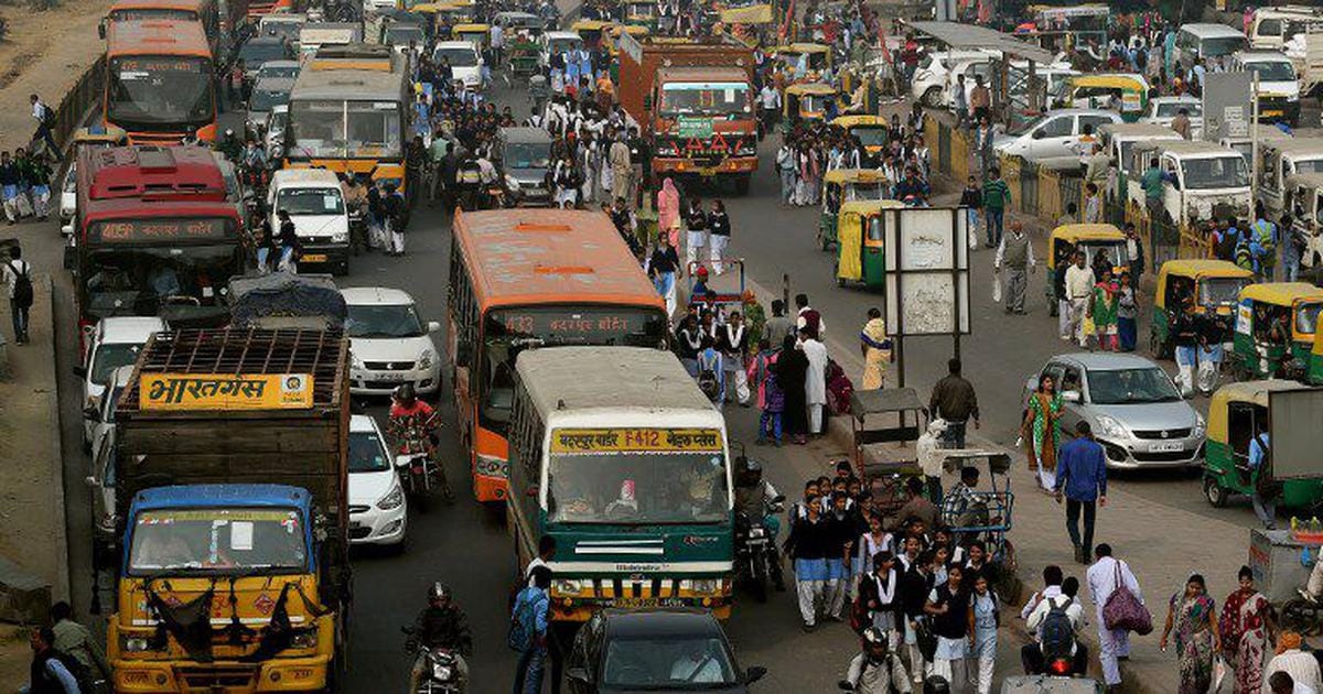 Chaotic traffic scene with pedestrians and cyclists on Indian roads