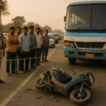 “Accident scene on Bhadrak–Chandbali road with damaged scooter, private bus, crowd and police investigation”