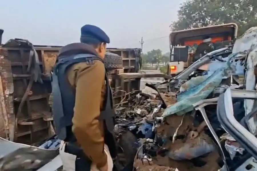 Mangled wreckage of a Toyota Fortuner SUV crushed under a sand-laden tractor after fatal high-speed collision on Gwalior-Jhansi Highway, Madhya Pradesh